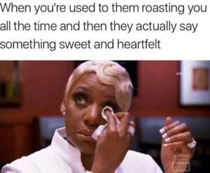 Woman wiping tears with a cotton pad, illustrating memes about sibling relationships and unexpected heartfelt moments.