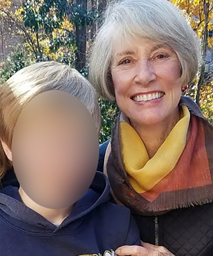 Older woman smiling outdoors with blurred boy, highlighting ChatGPT accused of turning son against his mother before final act.