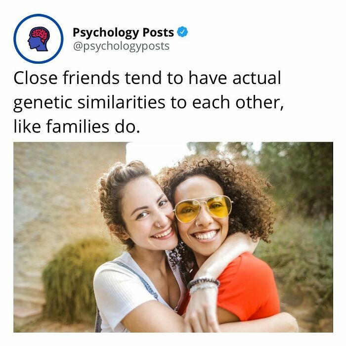 Two close friends smiling and hugging outdoors, illustrating fun and fascinating psychology facts about genetic similarities.