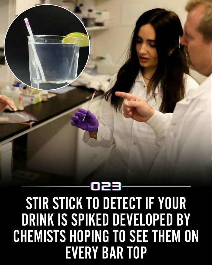 Scientists demonstrating a positivity recommended stir stick that detects if a drink is spiked in a laboratory setting.