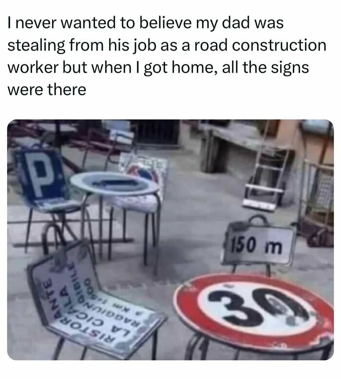 Chairs and tables made from road construction signs creating a funny dad joke scene about stealing signs at home.