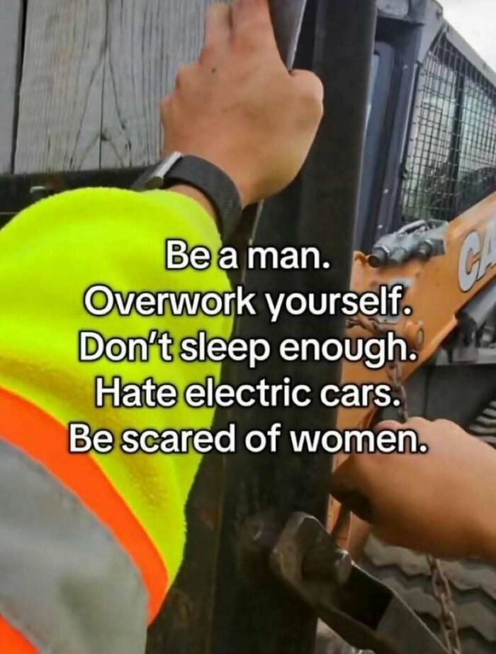Hand in high-visibility jacket holding construction vehicle with text overlay in funny unhinged memes style.
