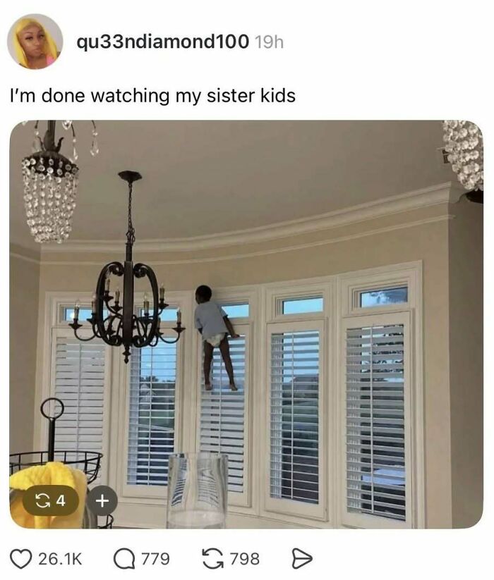 Child wearing a diaper climbing window blinds inside a home, a funny meme from Know Your Meme collection.