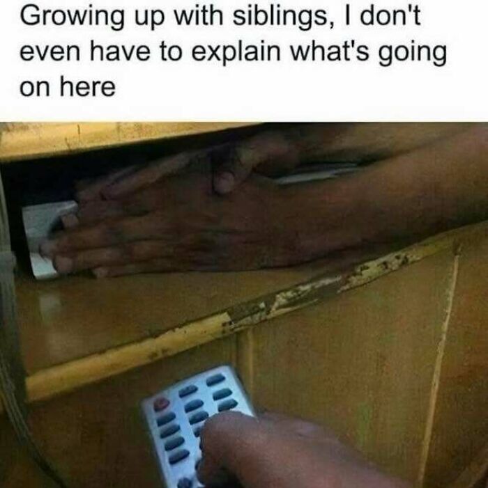 Hands hiding a remote control as a sibling tries to reach it, a relatable moment from popular Know Your Meme content.