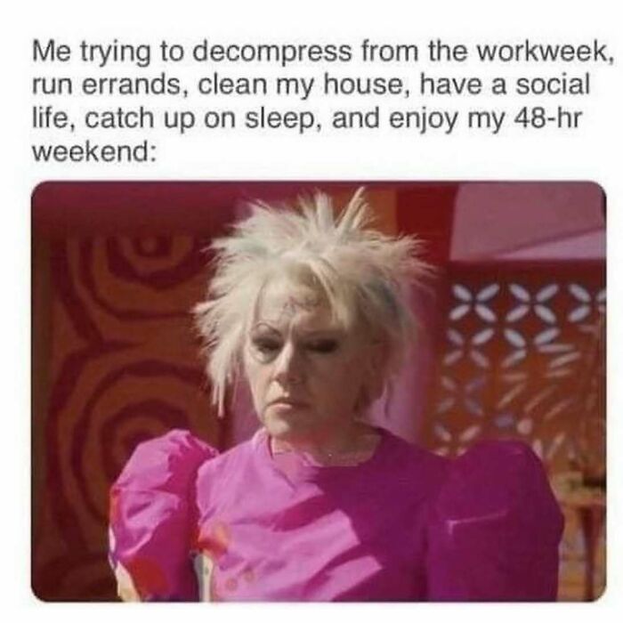 Woman with messy hair and tired expression in a bright pink dress, illustrating decompression after a busy workweek meme.