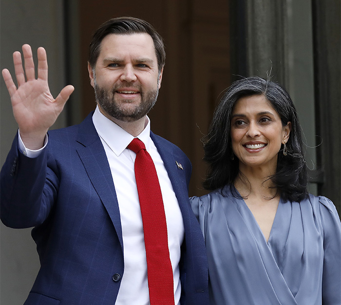 JD Vance and wife Usha smiling together outside a building amid public speculation about their marriage.