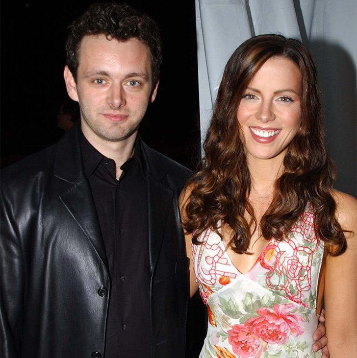 Michael Sheen smiling with a woman at an event, highlighting Michael Sheen's dating history and fan reactions.