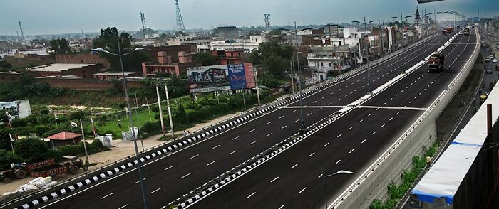 Empty highway leading through a city under cloudy skies, reflecting a somber tone in the horrifying wedding tragedy case.