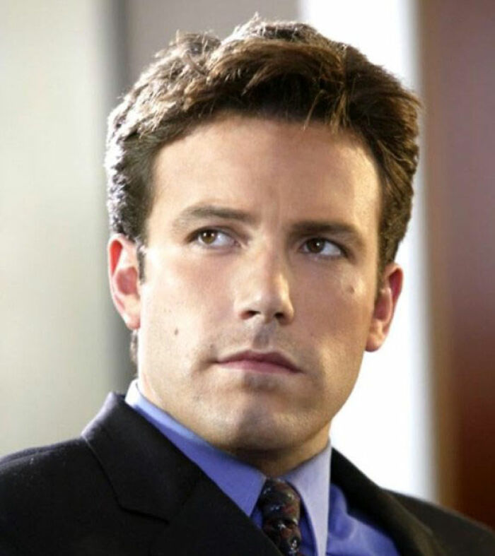 Ben Affleck looking serious in a suit and tie, related to Steven Spielberg refusing to work with him.