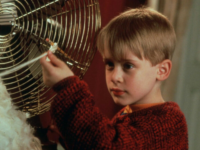 Macaulay Culkin as Kevin in Home Alone, addressing long-running theory about Kevin&rsquo;s dad&rsquo;s job in the film.