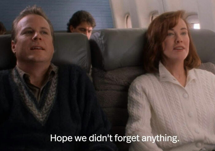 Scene from Home Alone showing Kevin&rsquo;s parents seated on a plane, related to Macaulay Culkin and Kevin&rsquo;s dad&rsquo;s job theory.