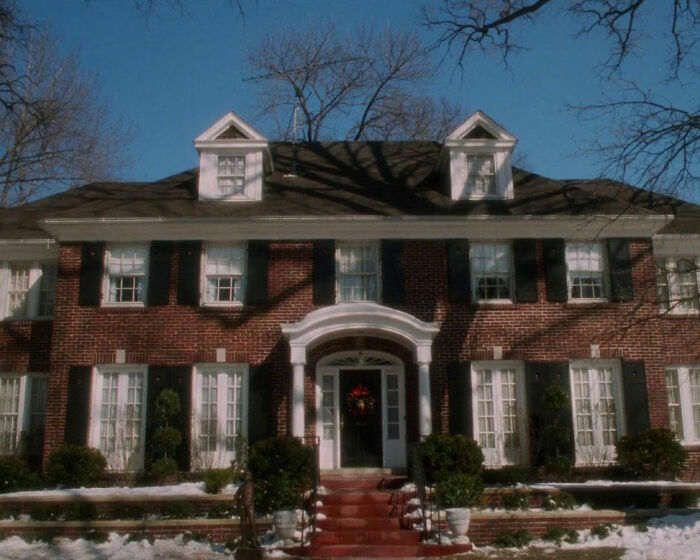 Classic red brick house from Home Alone, related to Macaulay Culkin and Kevin&rsquo;s dad job theory discussion.