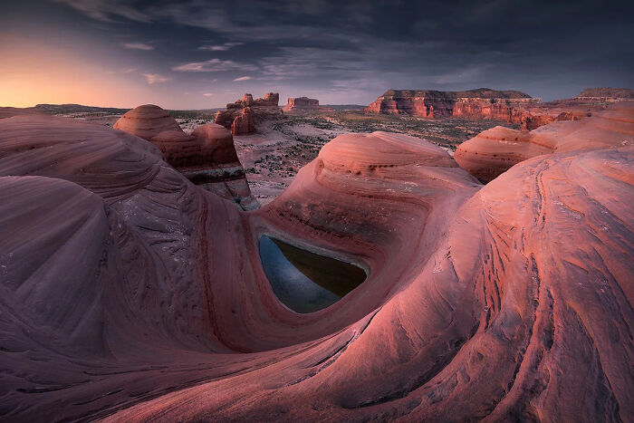 Vibrant red rock formations under a dramatic sky showcasing the best nature photography from international photo awards.