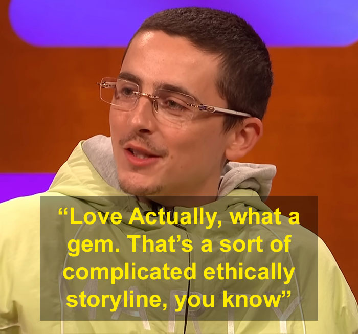 Young man wearing glasses and a green hoodie discussing Timothée Chalamet Love Actually misread on a TV show. Young man wearing glasses and a green hoodie discussing Timothée Chalamet Love Actually misread on a TV show.