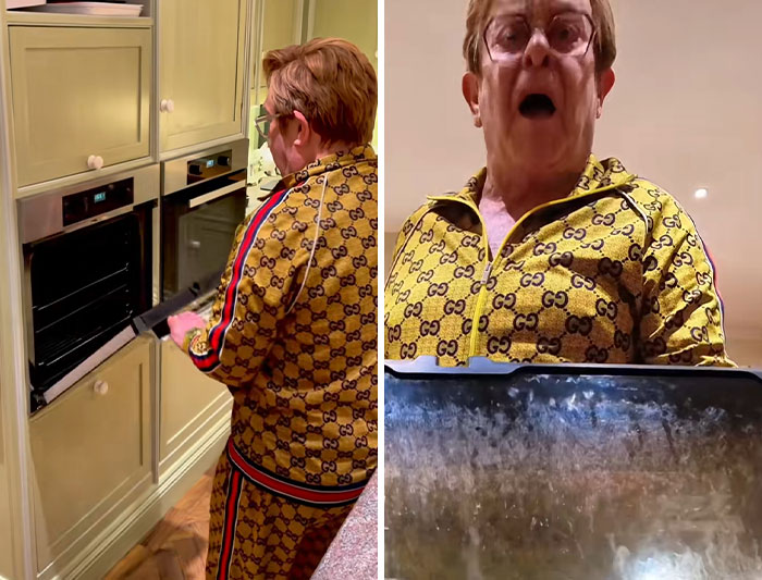 Elton John clapping back at fans while standing in his kitchen, wearing a patterned tracksuit and glasses. Elton John clapping back at fans while standing in his kitchen, wearing a patterned tracksuit and glasses.