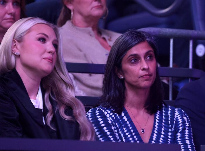 Two women seated in an audience, with focus on JD Vance marriage speculation after Erika Kirk viral hug and Usha&rsquo;s bare finger.