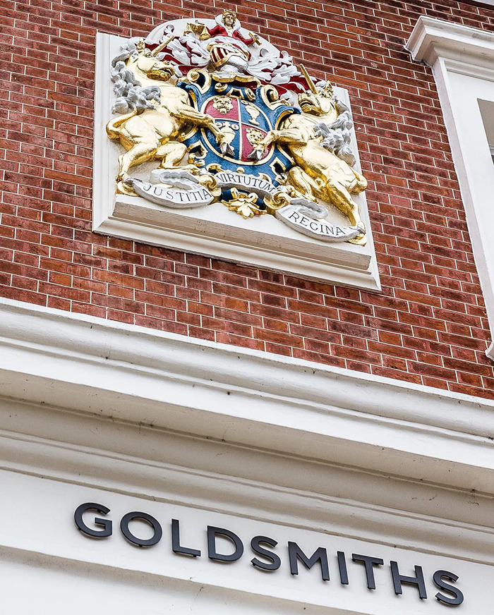 Goldsmiths building facade with ornate crest, symbolizing reputation linked to wealthy US student behavior after altercation.