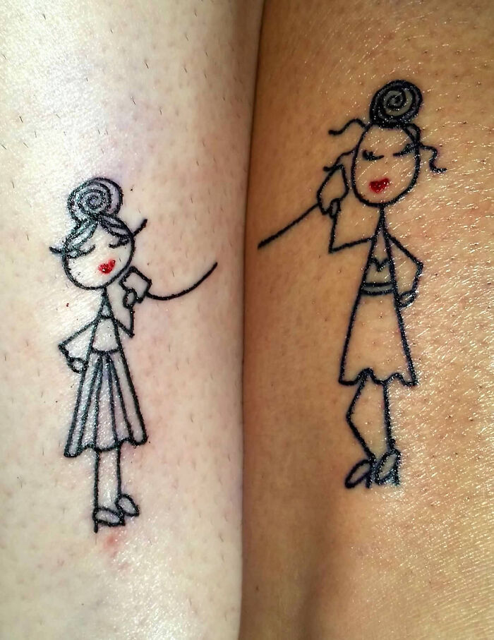 Matching wholesome tattoos of two stick-figure women with red lips connected by a string showcasing meaningful ink designs.