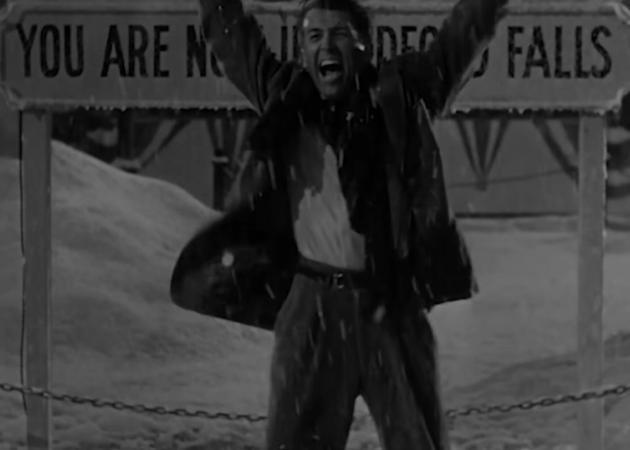 Man celebrating in snow in a crucial scene from a beloved Christmas classic criticized by Amazon Prime for cutting.