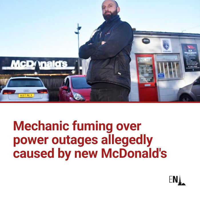 Mechanic standing with arms crossed outside McDonald's, featured in local newspaper headline about power outages.