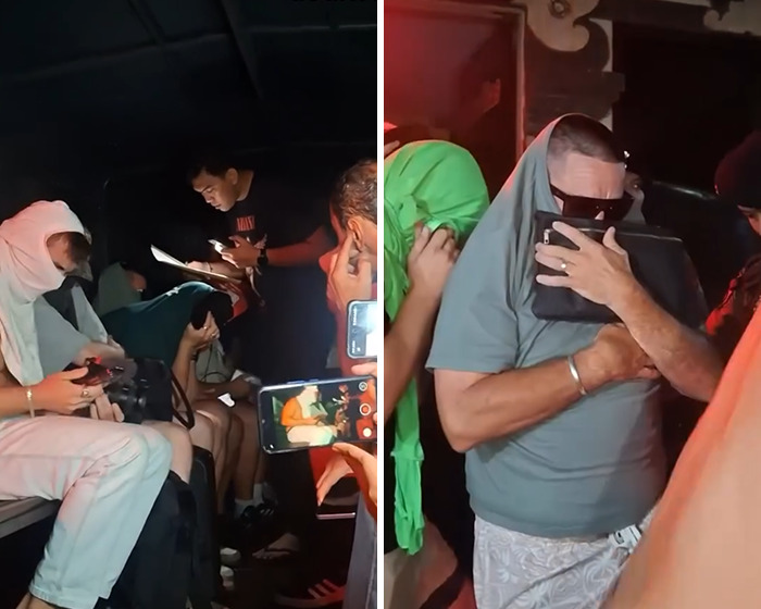 Group of people filming and reacting in a dimly lit room following news about Bonnie Blue&rsquo;s arrest.