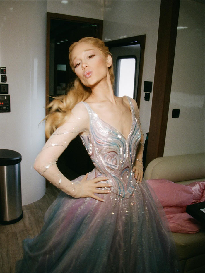 Ariana Grande posing confidently indoors, wearing a shimmering gown, highlighting body-shaming awareness and public reaction. Ariana Grande posing confidently indoors, wearing a shimmering gown, highlighting body-shaming awareness and public reaction.