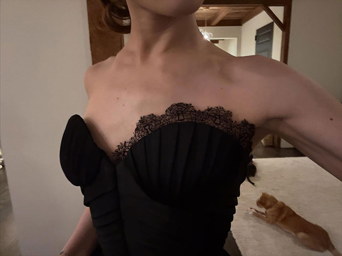 Close-up of a woman in a black lace dress highlighting a reminder about body-shaming awareness and self-acceptance. Close-up of a woman in a black lace dress highlighting a reminder about body-shaming awareness and self-acceptance.