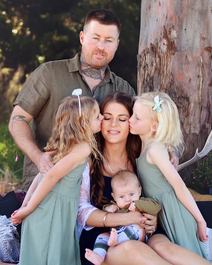 Family portrait showing a mom with children and husband, related to mom on life support after traveling to Vietnam for plastic surgery Family portrait showing a mom with children and husband, related to mom on life support after traveling to Vietnam for plastic surgery