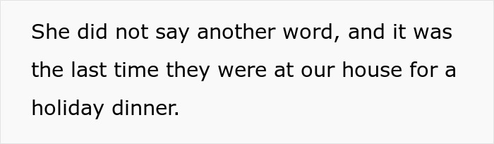 A cozy mil-house Christmas dog resting near festive holiday decorations in a warm, inviting home setting.