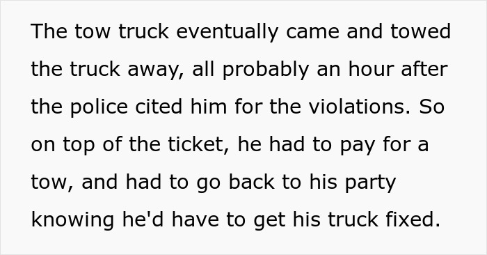 Tow truck towing a vehicle blocking fire hydrant and driveway after police issued a citation for illegal parking violations.