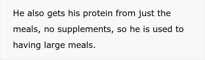 Guy eating a large turkey meal uncontrollably while girlfriend looks embarrassed in front of family during dinner.