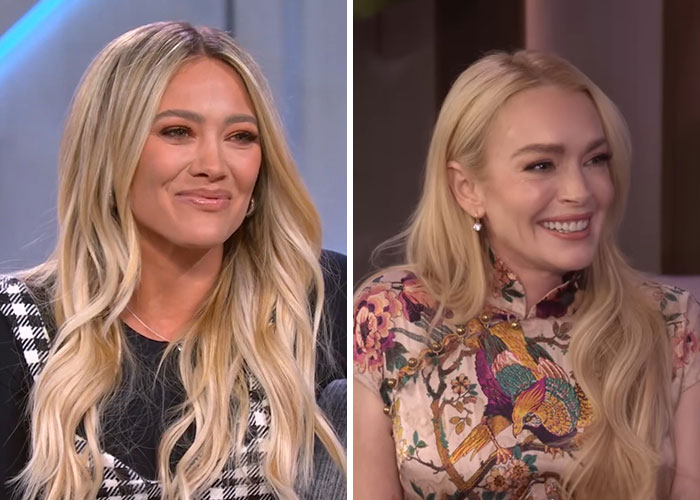 Two blonde women with long hair, one in a patterned black and white outfit and the other in a colorful floral dress, discussing dramatic Hollywood backstabbing moments.