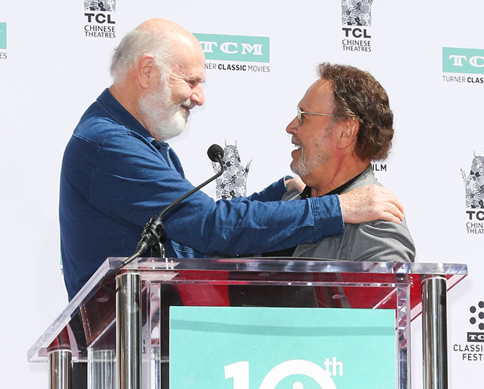 Billy Crystal and Rob Reiner share a moment on stage during a public event at TCL Chinese Theatres. Billy Crystal and Rob Reiner share a moment on stage during a public event at TCL Chinese Theatres.