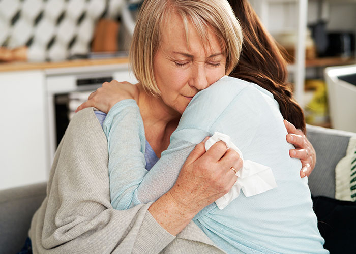 Woman rethinking engagement, emotional hug after fianc&eacute;&rsquo;s lie about family revealed during holiday dinner, comforting moment