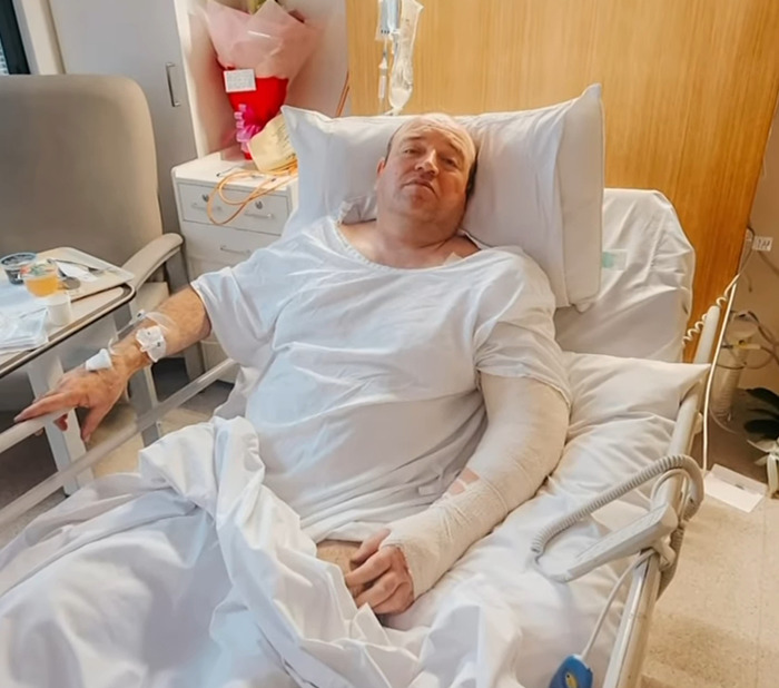 Bondi Beach hero resting in hospital bed with bandaged arm after confronting attacker, update revealed by lawyer