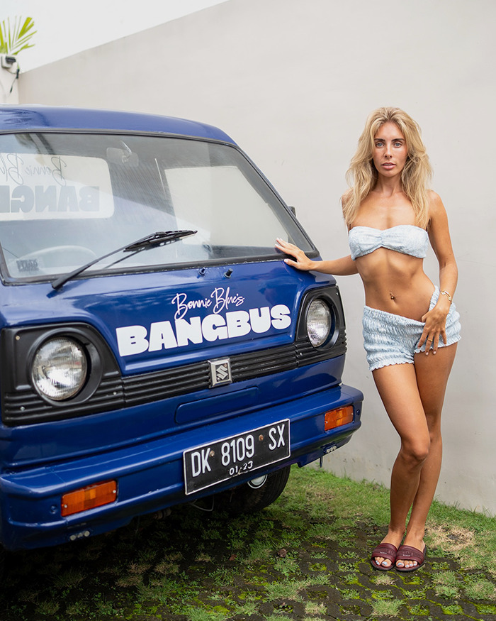 Adult star Bonnie Blue posing next to a blue van labeled Bangbus during a controversial tour outdoors. Adult star Bonnie Blue posing next to a blue van labeled Bangbus during a controversial tour outdoors.