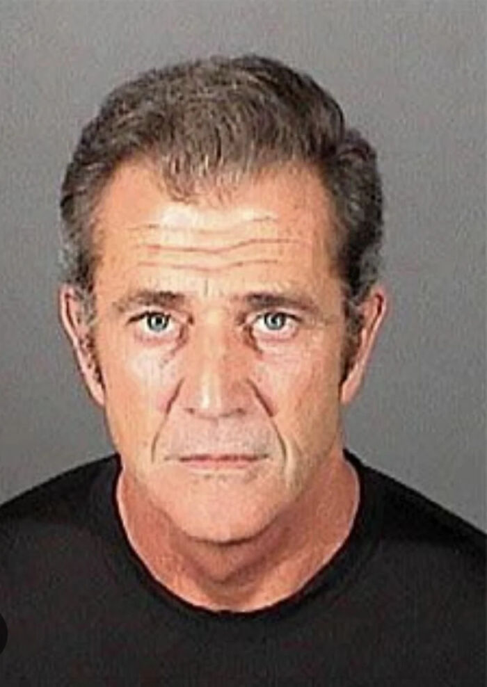 Mugshot of a male celebrity with serious expression, showcasing one of the times celebs had their mugshot taken after being arrested.