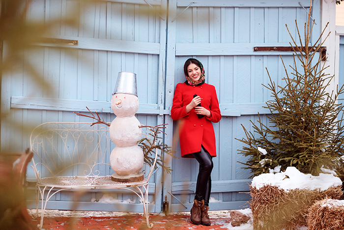 Woman standing next to festive Christmas decor outside, facing HOA fine for decorations deemed too excessive this holiday season Woman standing next to festive Christmas decor outside, facing HOA fine for decorations deemed too excessive this holiday season