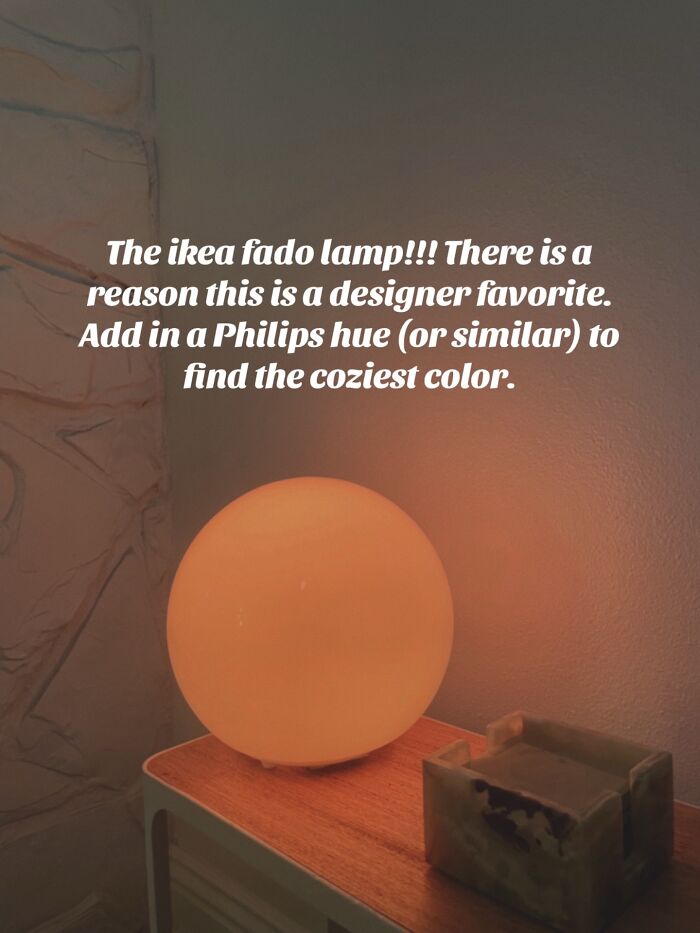 Ikea Fado lamp glowing warmly on a wooden surface, recommended Christmas gift for cozy home lighting.