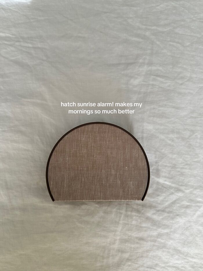 Hatch sunrise alarm clock on a bed, praised as a highly recommended Christmas gift for better mornings.