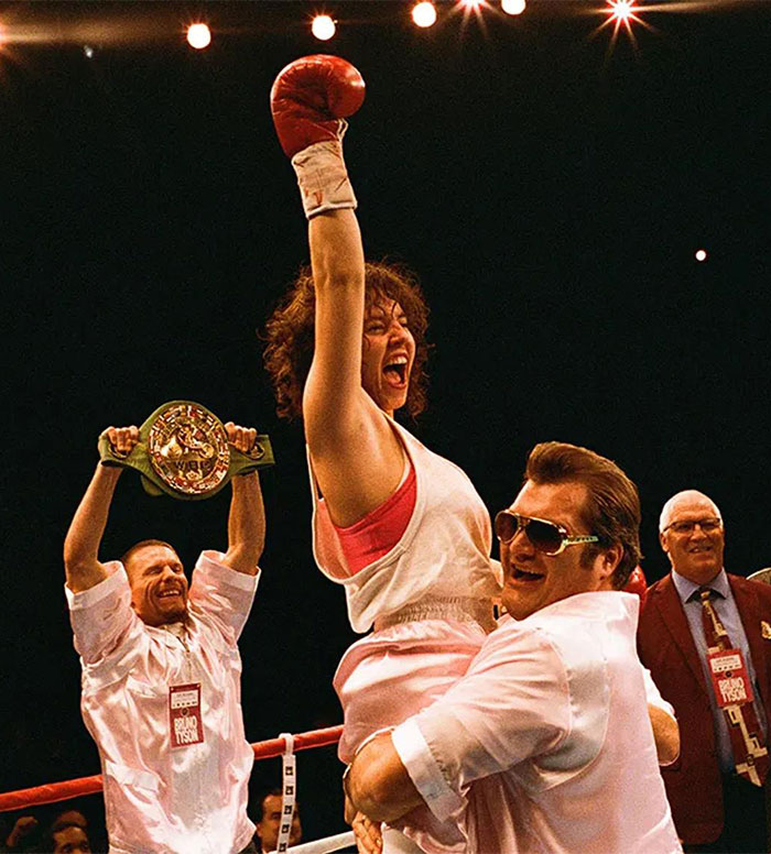 Sydney Sweeney celebrating a boxing win with team members in ring, fans spot odd detail on Sports Illustrated cover.