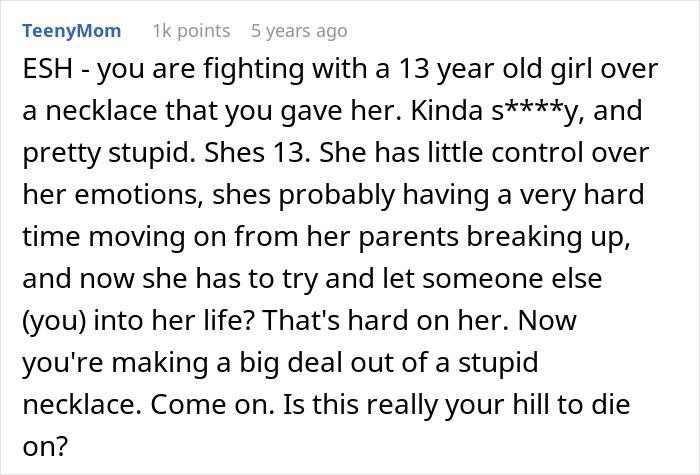 Comment discussing a 13-year-old girl's struggle with emotions and issues with dad's girlfriend's gift.