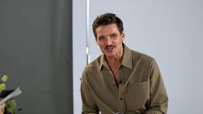 Actor in a casual olive shirt sharing stories about times mere mortals ran into different celebrities during an interview.