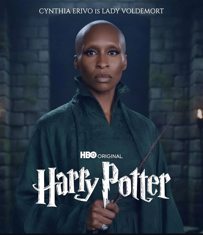 Cynthia Erivo in dark costume as Lord Voldemort, holding a wand in a dimly lit stone corridor for Harry Potter series.