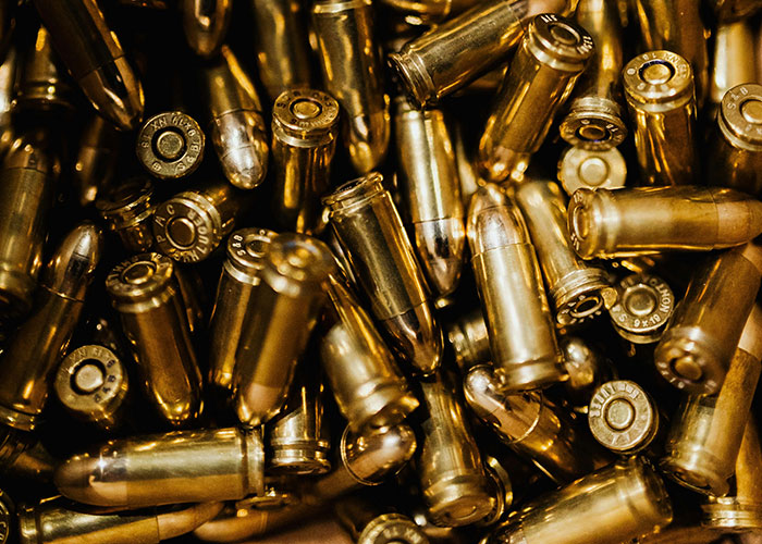 Close-up of brass bullets illustrating survival hacks that can be dangerous and useless in emergency situations