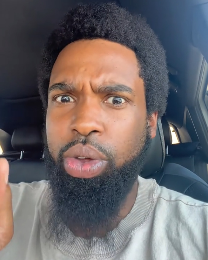 Man with a beard inside a car sharing a sad health update and explaining why he is on the streets, dad of Nickelodeon star.