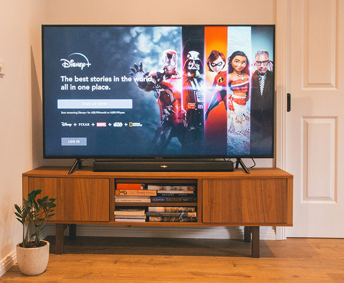 Disney streaming service displaying Marvel, Pixar, and Disney characters, highlighting what happened to Disney remakes debate.