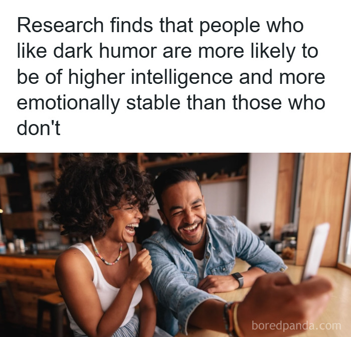 Two friends laughing together while taking a selfie, illustrating fun and fascinating psychology facts about humor and intelligence.