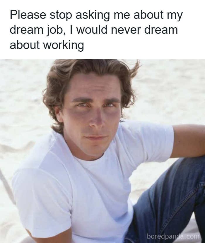 Man in white shirt sitting on sand with funny unhinged meme text about not dreaming of working.