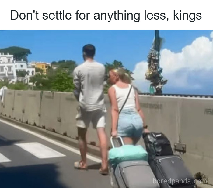 Couple walking with luggage on a sunny street under a sign reading don't settle for anything less, funny unhinged memes.